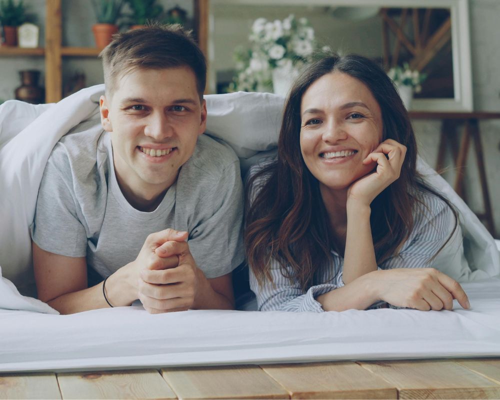 Couple relaxing together in a cozy setting, representing connection and intimacy